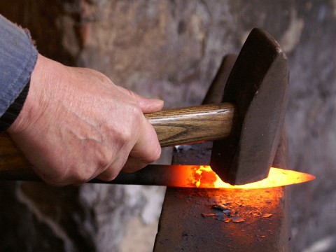 glowing hot metal on a blacksmith's anvil